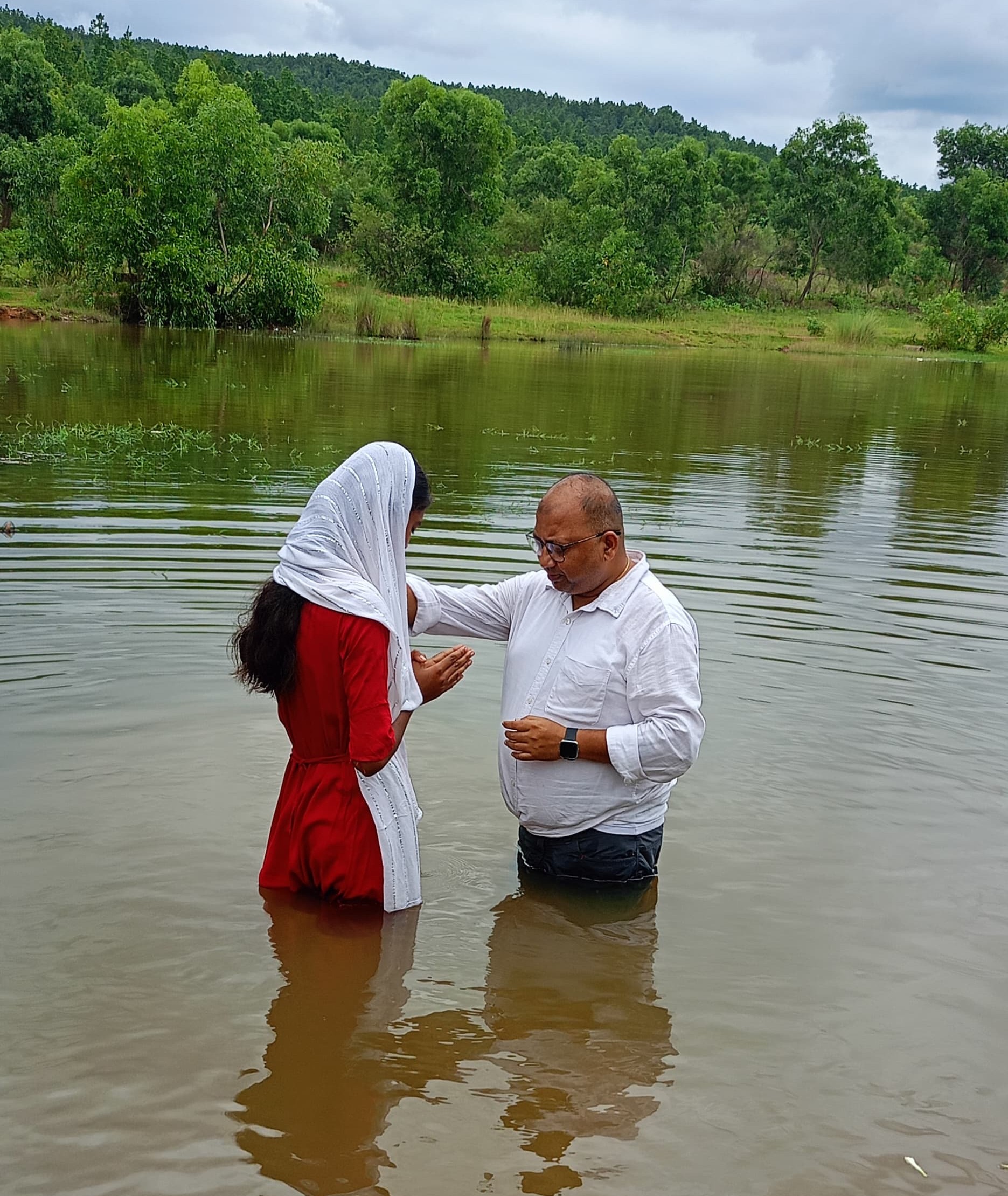 Baptising young girl