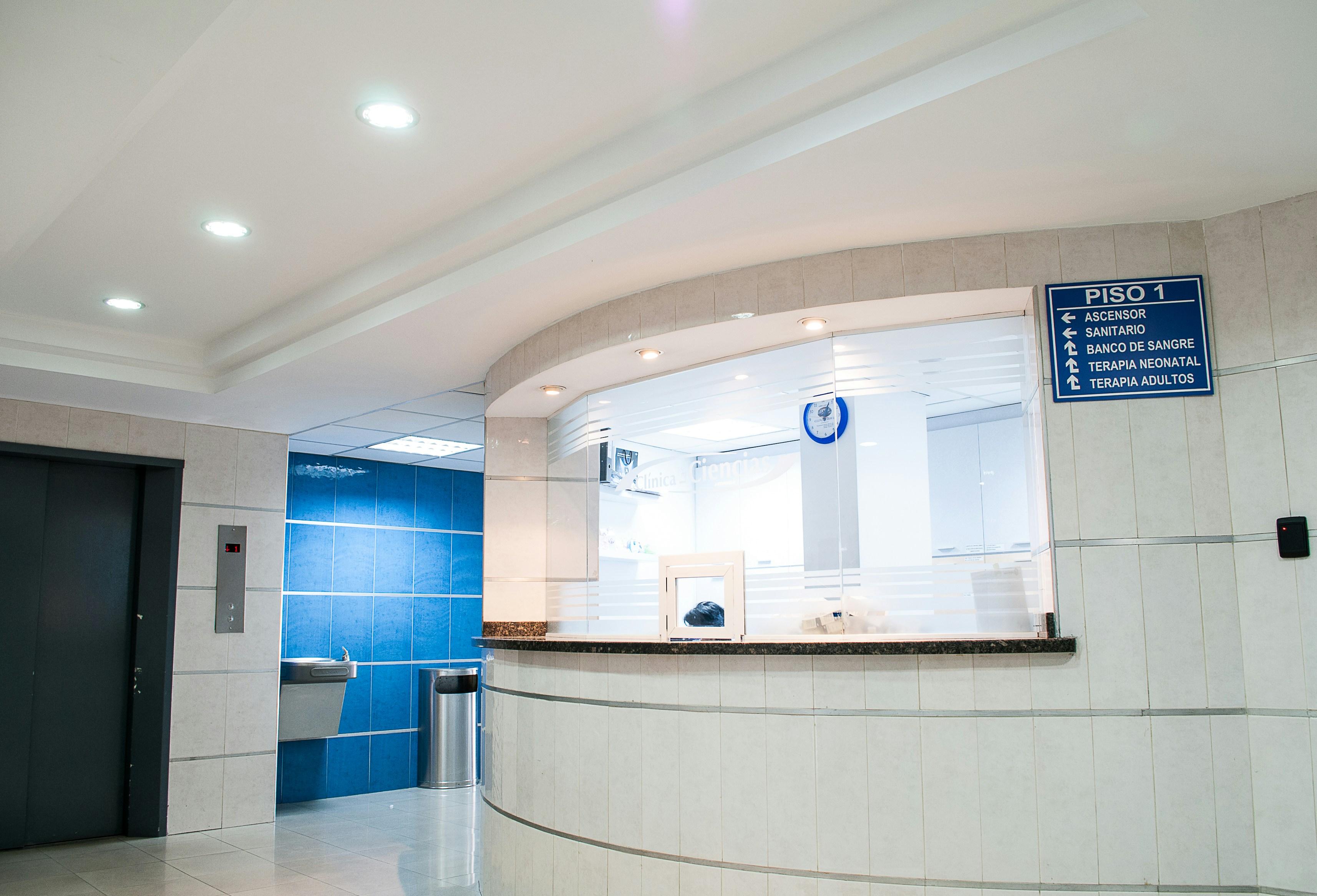 Modern hospital reception area with blue and white decor