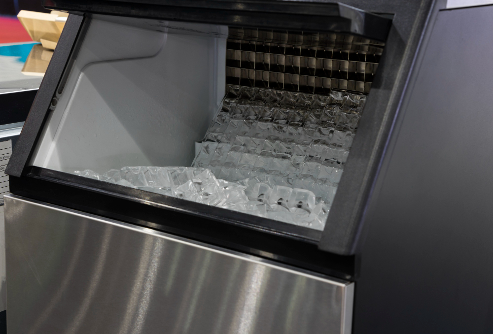 Commercial ice maker machine with ice cubes inside