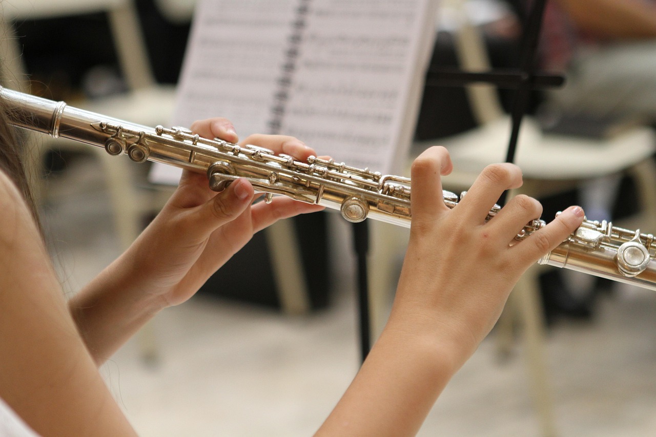 Young girl playing the flute