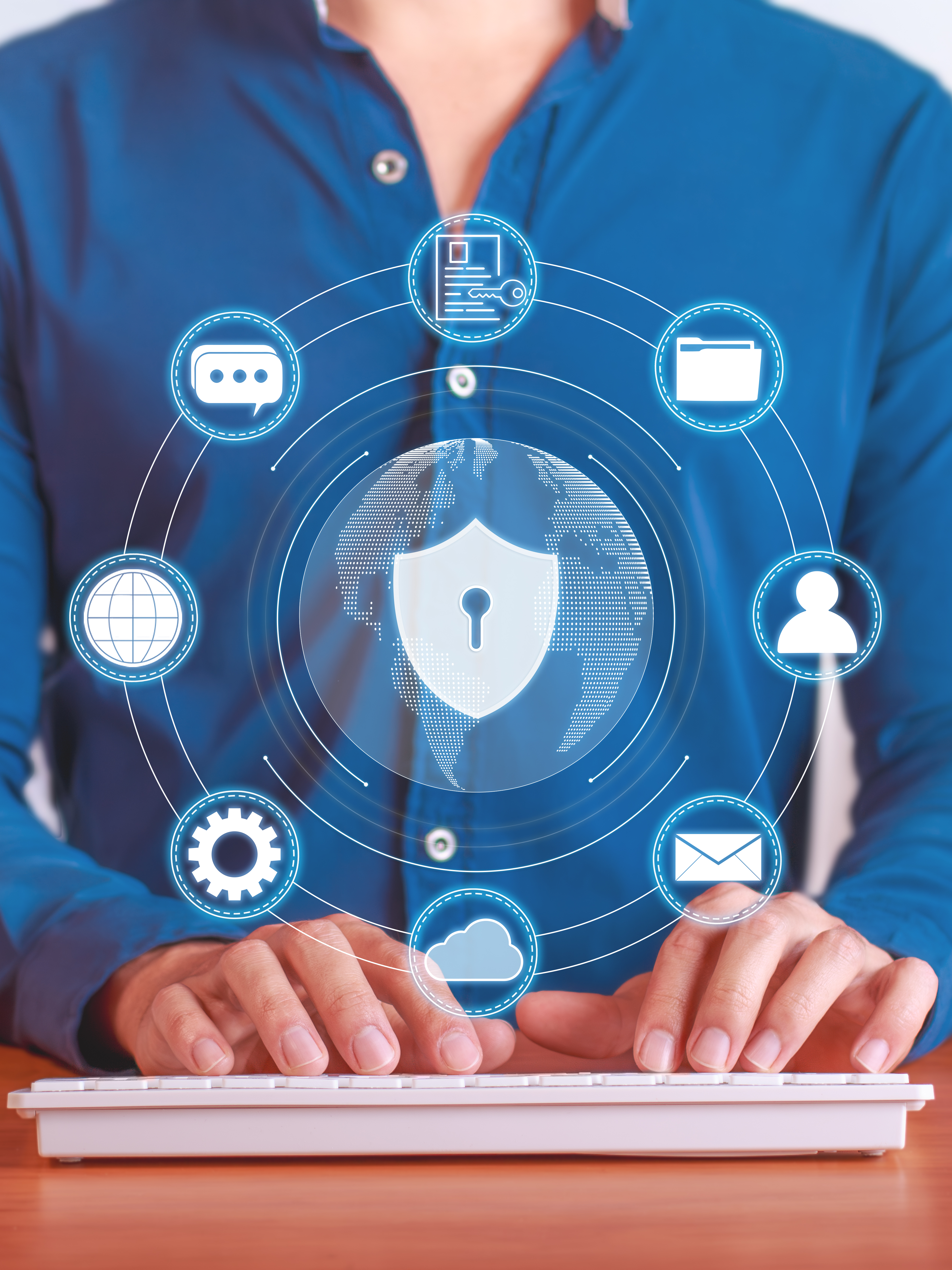 Laptop screen with glowing padlock icons and hands using a smartphone, showing cybersecurity protection.