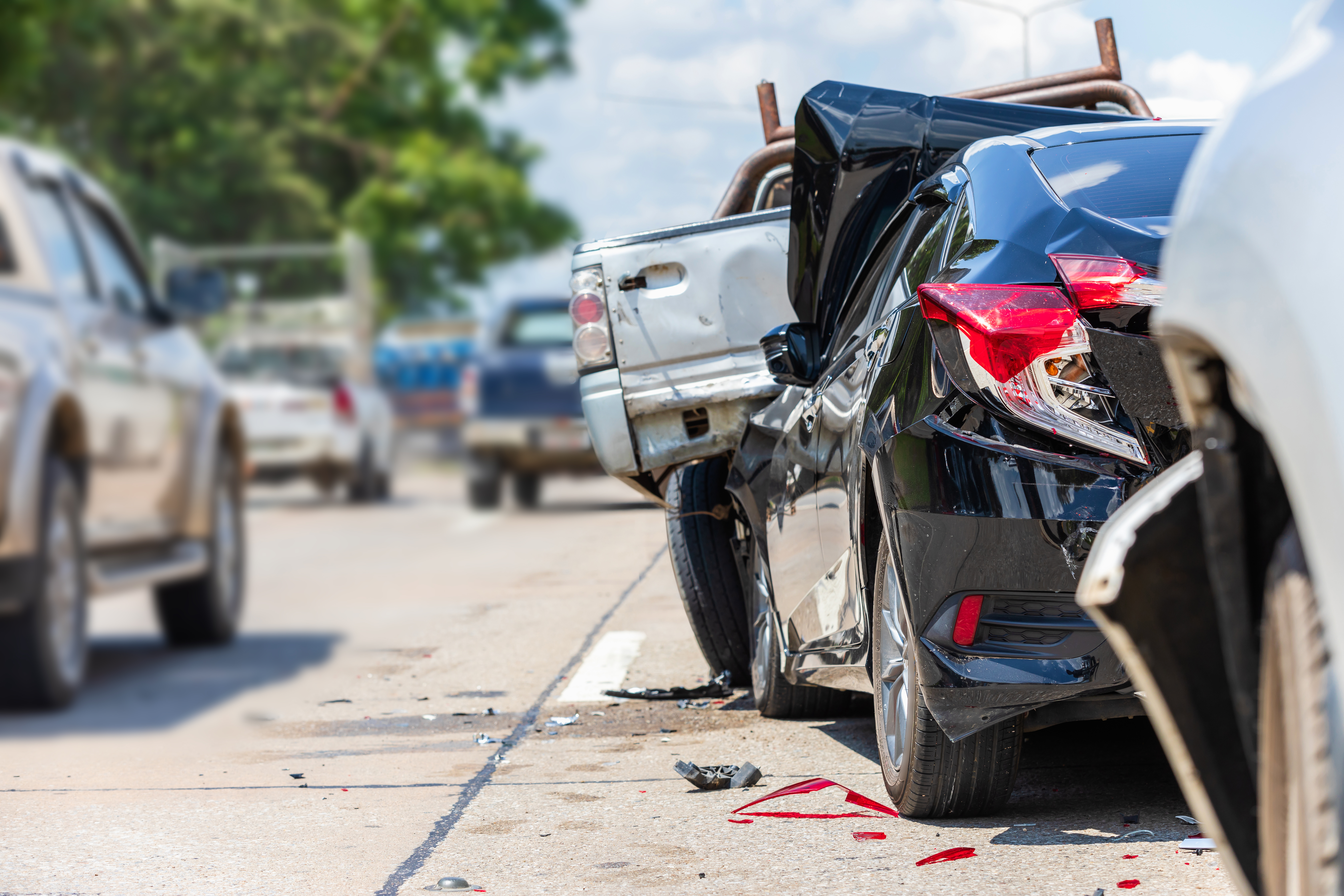 Rear-end collision involving multiple vehicles on a busy road