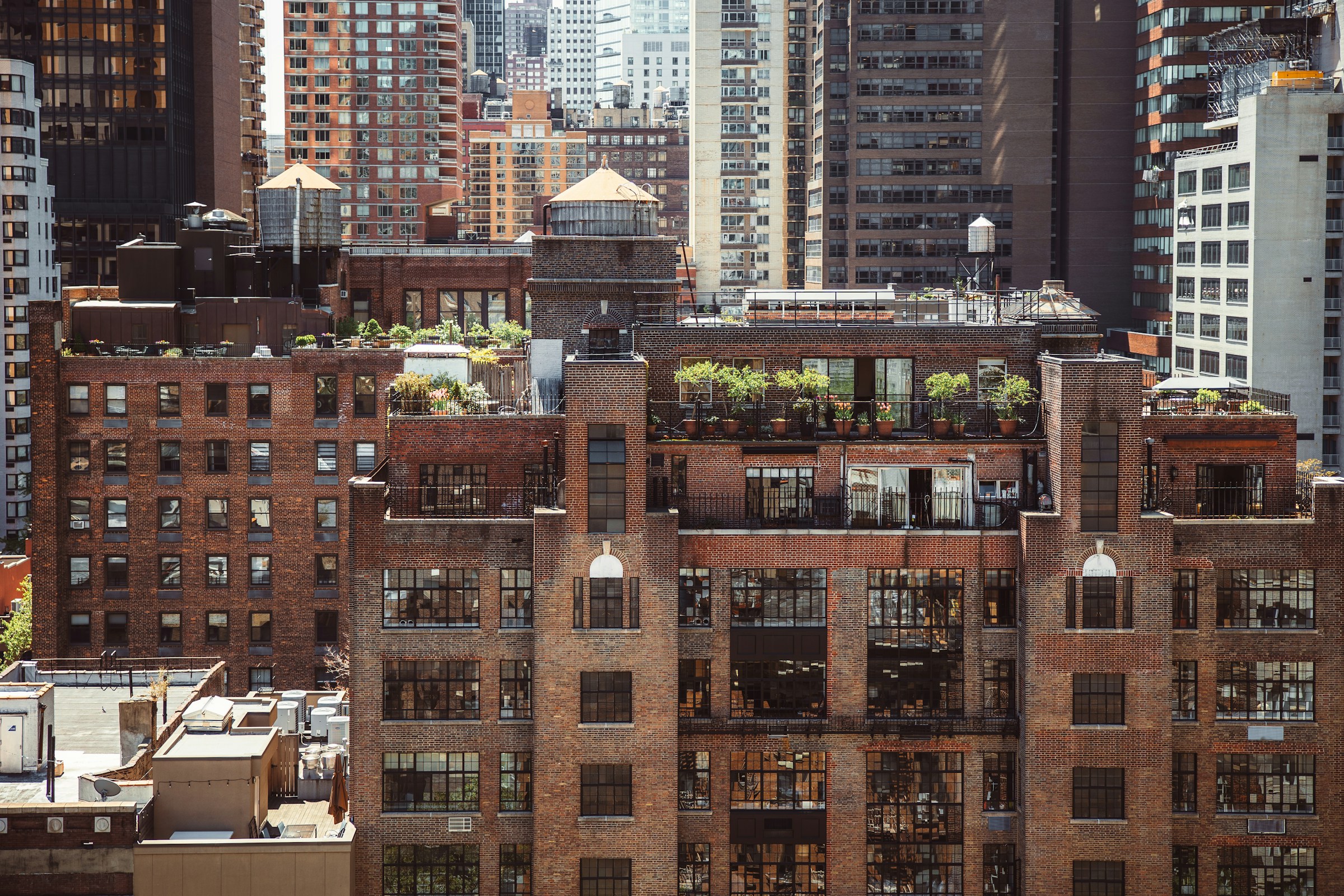 Urban skyline with brick buildings and rooftop gardens