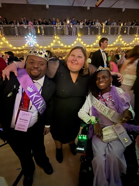 A group of children are sitting on the ground playing with clay.