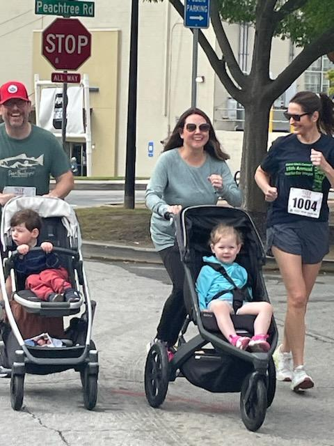 A group of children are sitting on the ground playing with clay.