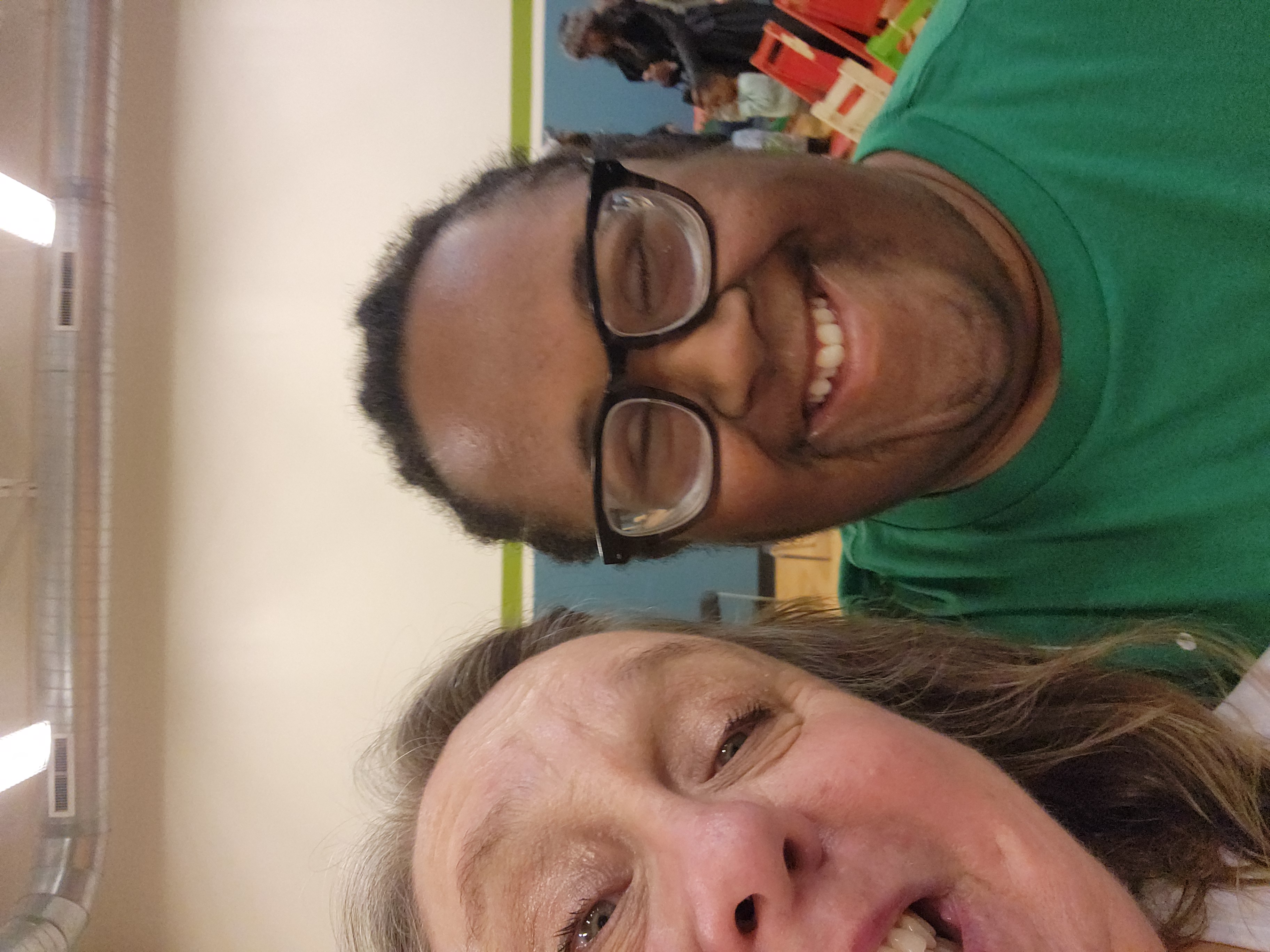 A group of children are sitting on the ground playing with clay.