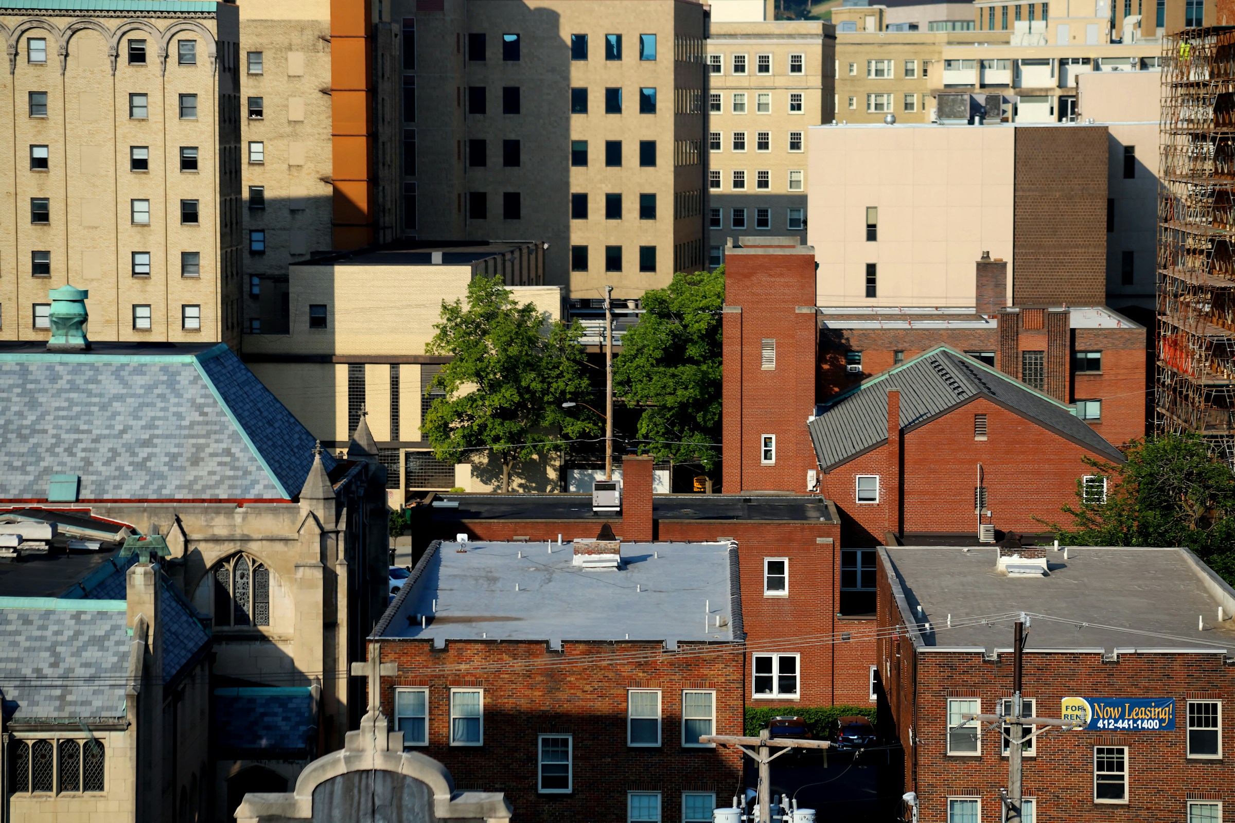Urban landscape with various buildings including brick structures and modern high-rises