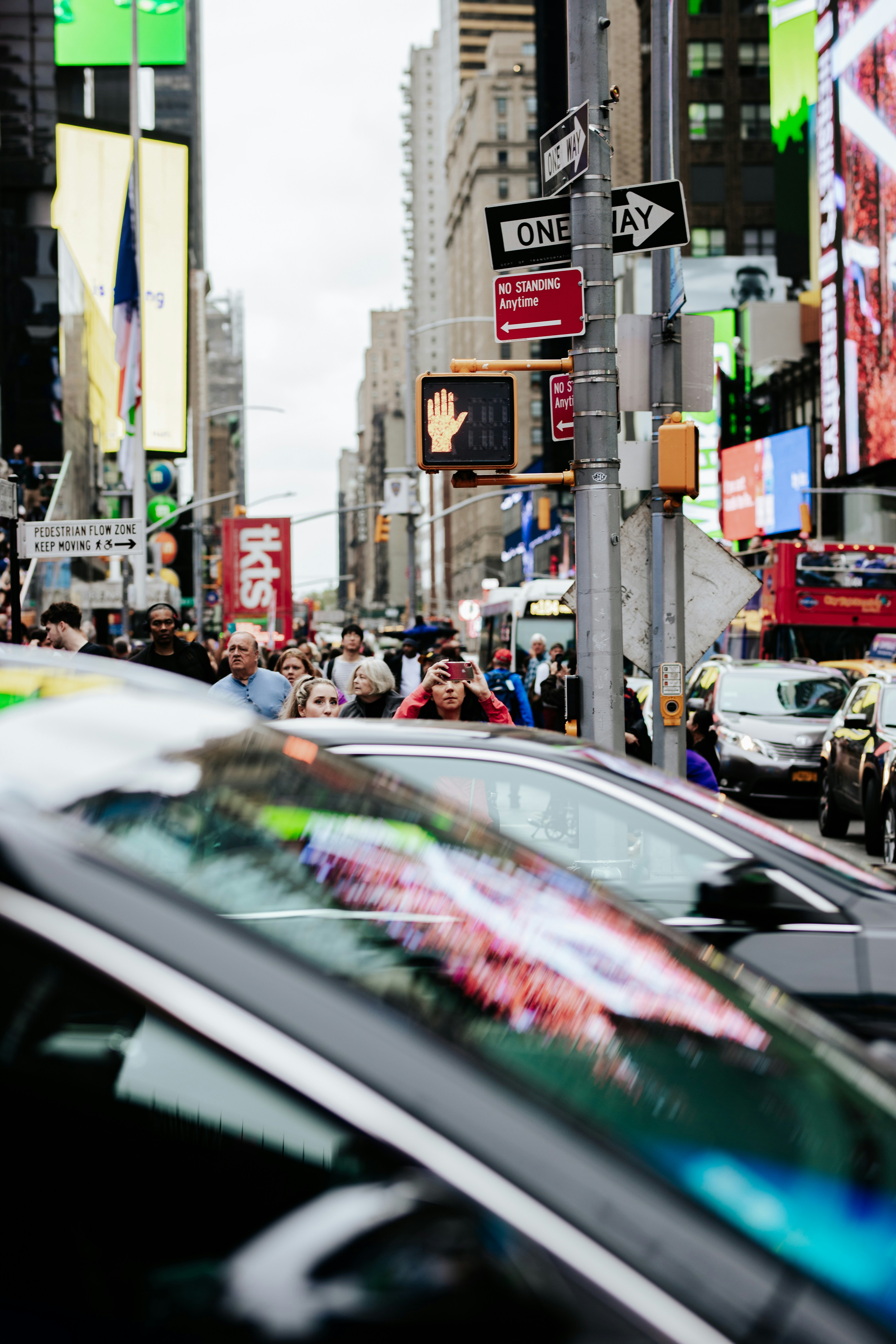 Busy city street with cars and pedestrians in an urban area