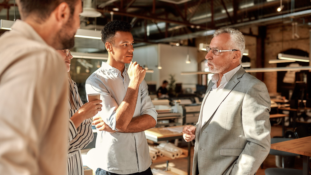 Group of professionals having a discussion in a modern office space