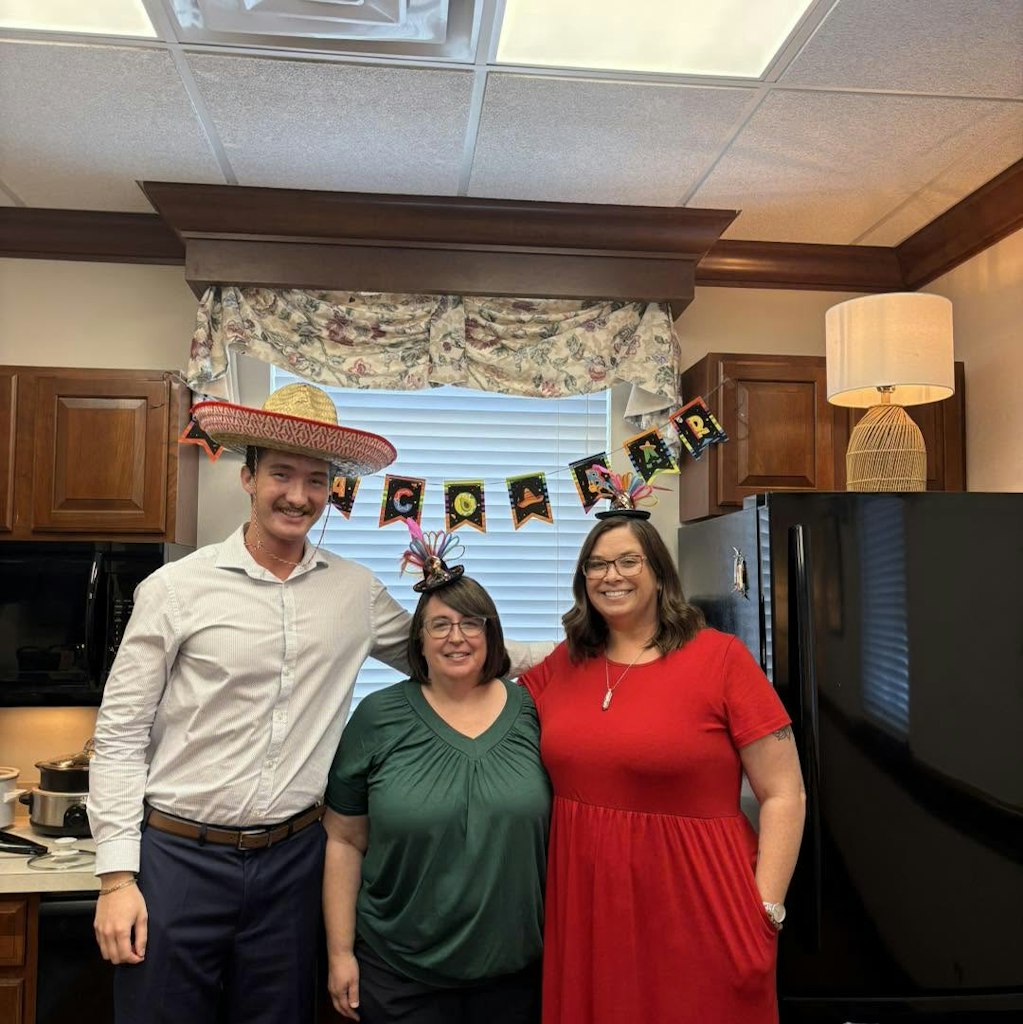 Three Fairfield Federal Bank employees smiling in a group.