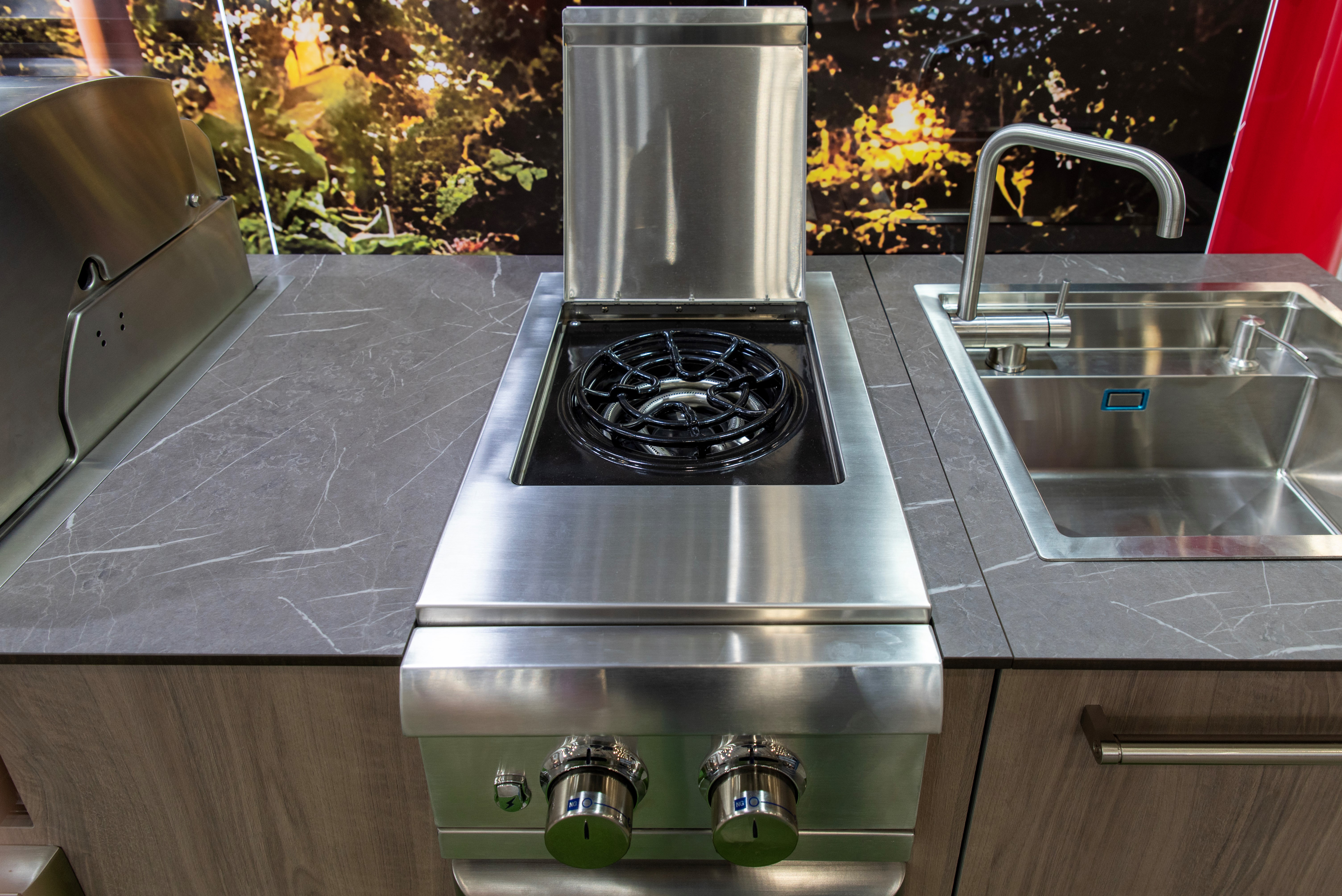 Stainless steel outdoor kitchen with built-in grill and sink