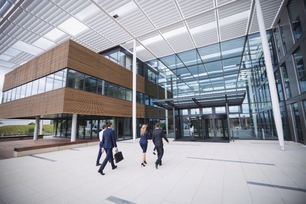 Business professionals walking towards a modern office building